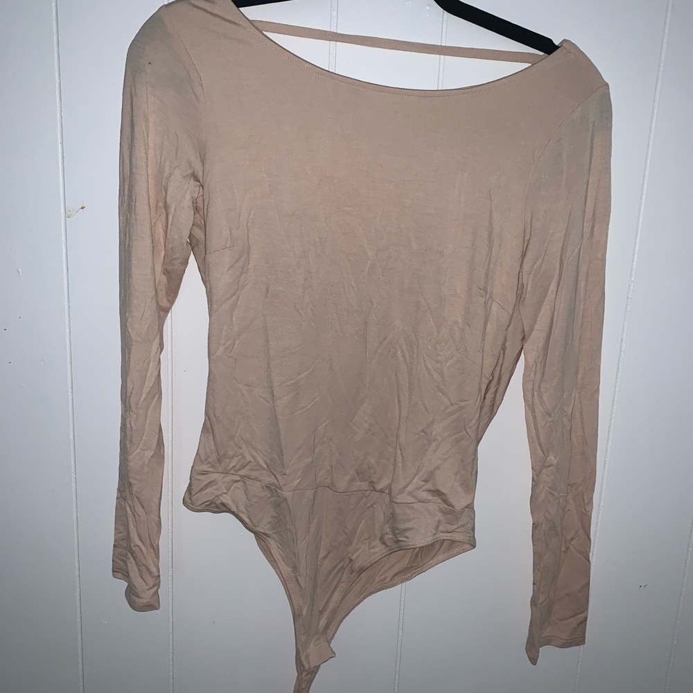Pinkish blush body suit, open back, super cute.